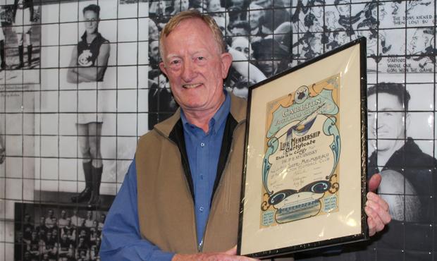 Philip McCumisky with his late father's Life Membership certificate. (Photo: Carlton Football Club)