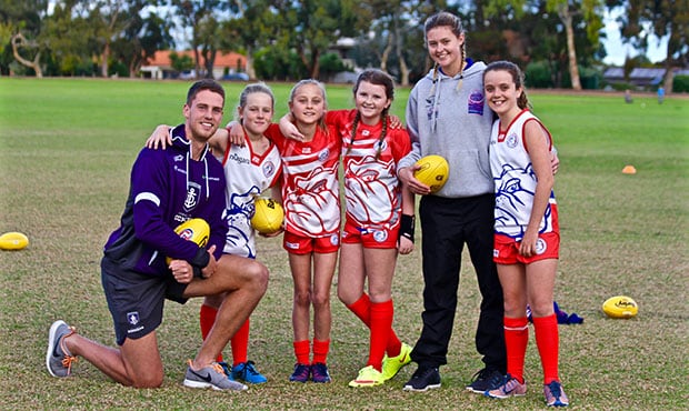 Jack Hannath, Tyana Johnson and players from the Booragoon Junior Football Club under 12s team.