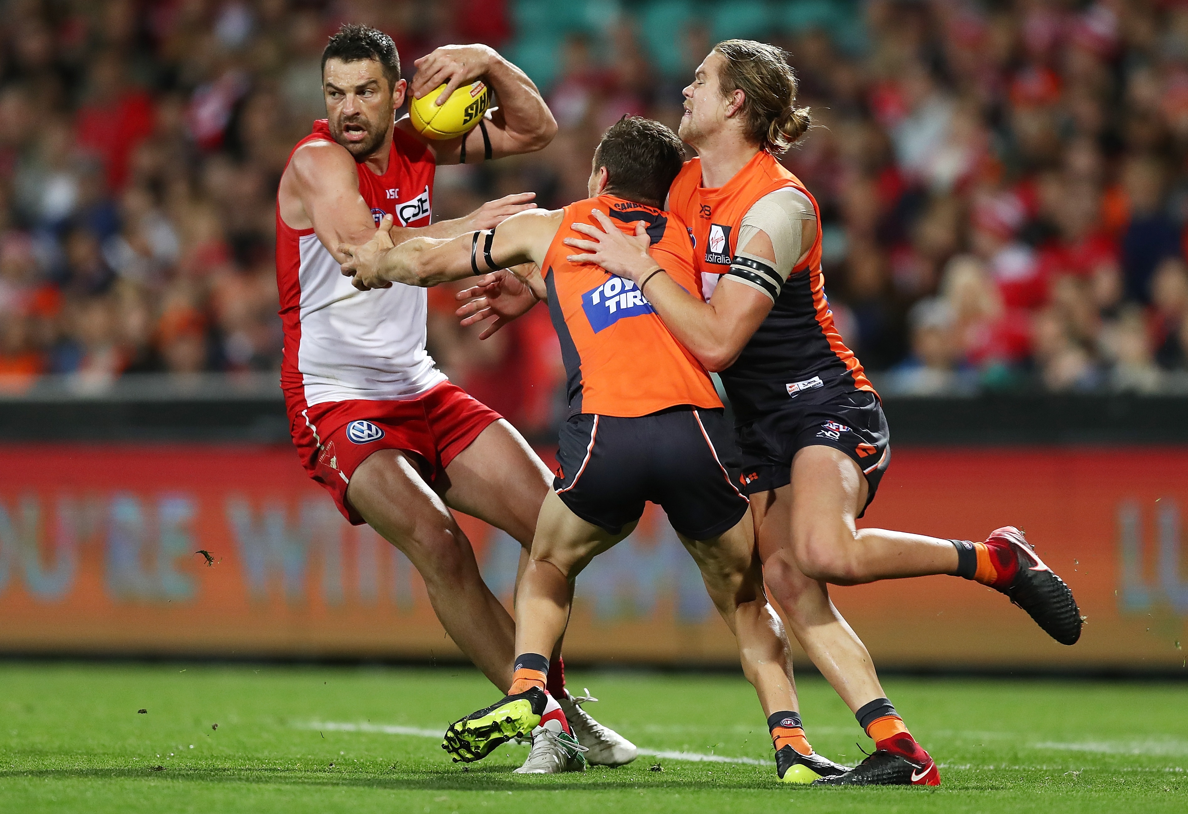 Adelaide, Australia. 03rd June, 2023. Conor Nash of the Hawks is tackled by  Dan Houston and Riley Bonner of the Power during the AFL Round 12 match  between the Port Adelaide Power