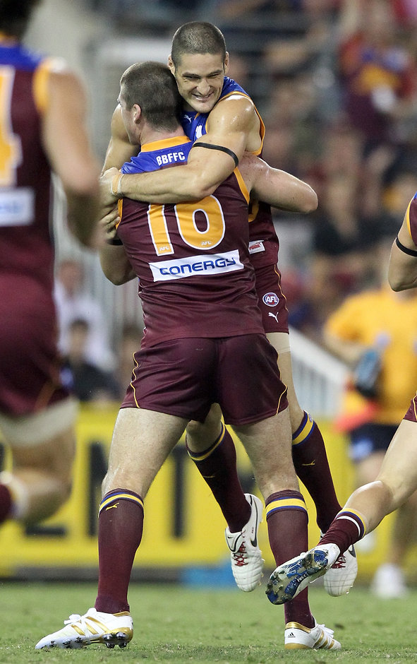 AFL 2010 Rd 02 - Brisbane v Carlton Brendan Fevola and Jonathan Brown embrace in round two, 2010 when the Gabba was last a sellout - AFL,Brisbane Lions