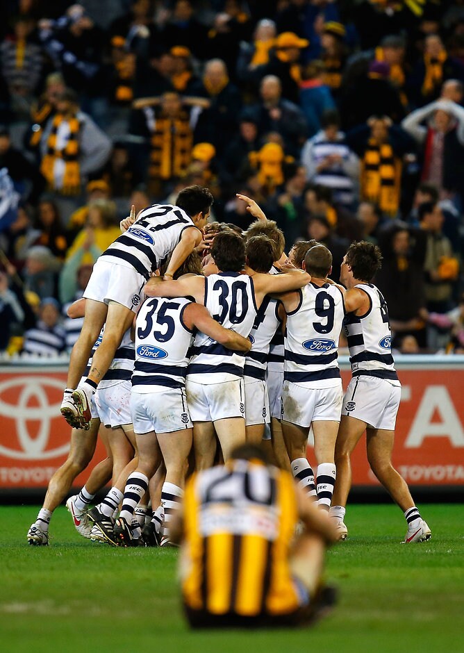 Hawthorn versing Geelong and kicking off a goal