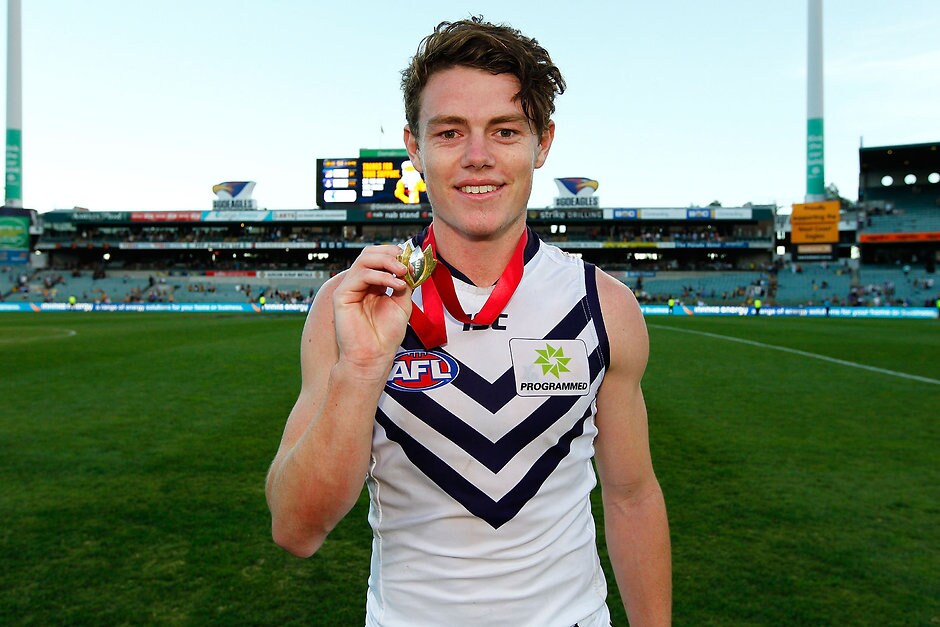 AFL 2015 Rd 03 - West Coast v Fremantle Lachie Neale with the Ross Glendinning Medal in 2015. - Fremantle,Fremantle Dockers,Optus Stadium