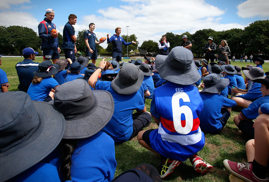AFL 2016 Media - Western Bulldogs Community Camp BALLARAT, AUSTRALIA - FEBRUARY 16: Bulldogs players talk to students during the Western Bulldogs Community Camp clinic for Pleasant Street Primary School students at the City Oval in Ballarat, Australia on February 16, 2016. (Photo by Adam Trafford/AFL Media)