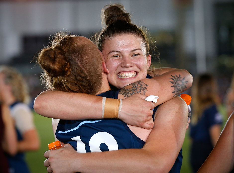 AFLW 2017 Rd 01 - Carlton v Collingwood MELBOURNE, AUSTRALIA - FEBRUARY 3: Bella Ayre of the Blues (right) hugs Tilly Lucas-Rodd of the Blues during the 2017 AFLW Round 01 match between the Carlton Blues and the Collingwood Magpies at Ikon Park on February 3, 2017 in Melbourne, Australia. (Photo by Adam Trafford/AFL Media)