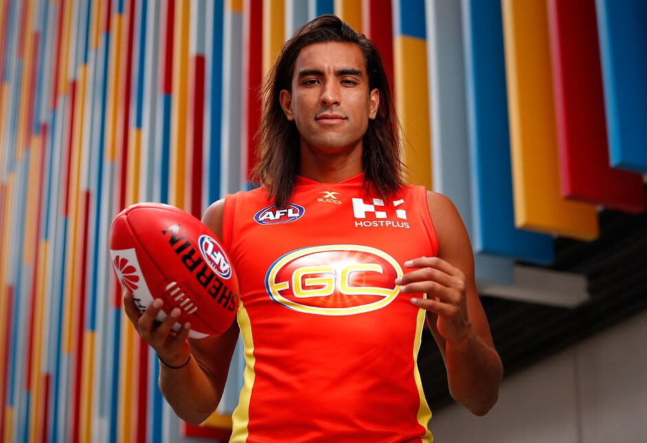 AFL 2017 Portraits - Gold Coast Suns GOLD COAST, AUSTRALIA - FEBRUARY 23: Tom Nicholls of the Suns poses for a portrait during the Gold Coast Suns team photo day at Metricon Stadium on February 23, 2017 in Gold Coast, Australia. (Photo by Adam Trafford/AFL Media)