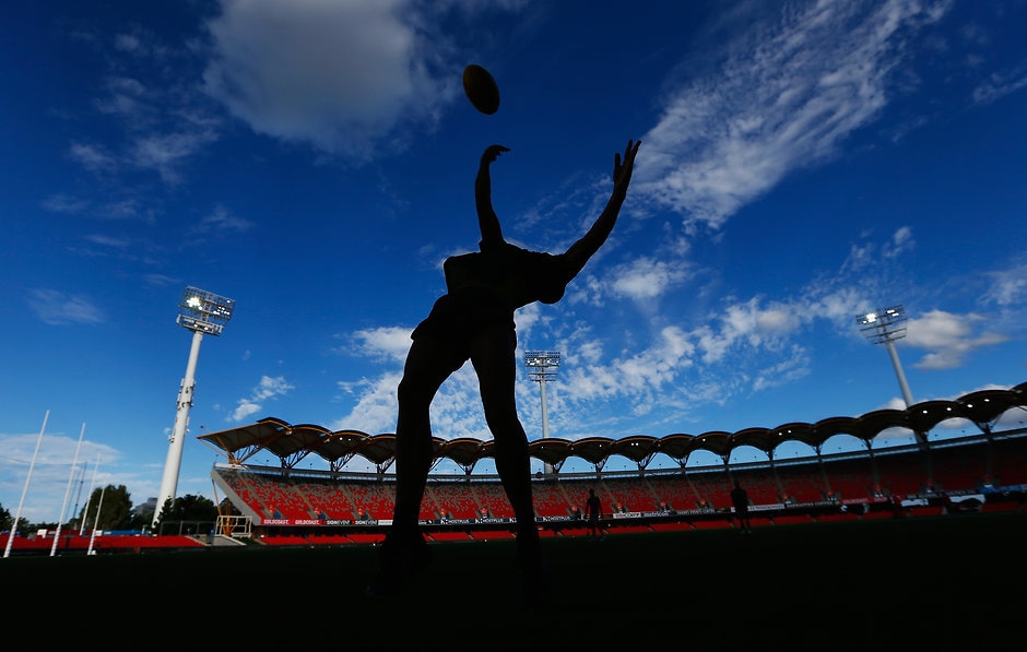 AFL 2017 JLT Community Series - Gold Coast Suns v Western Bulldogs GOLD COAST, AUSTRALIA - MARCH 09: General view as a boundary umpire warms up during the JLTR Community Series AFL match between the Gold Coast Suns and the Western Bulldogs at Metricon Stadium on March 9, 2017 in Gold Coast, Australia. (Photo by Jason O'Brien/AFL Media/Getty Images)
