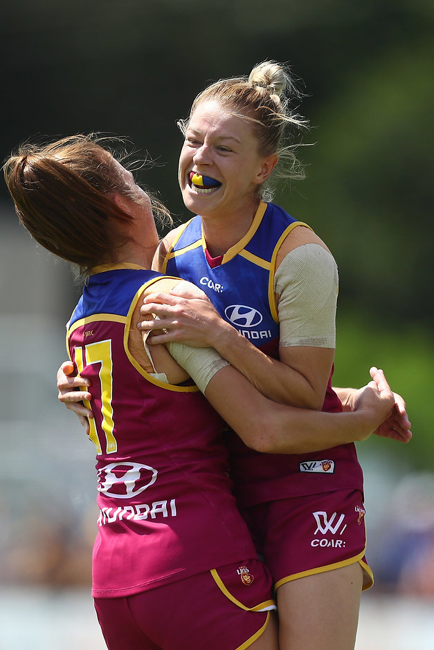 AFLW 2017 Rd 06 - Brisbane v Western Bulldogs BRISBANE, AUSTRALIA - MARCH 11: Kate McCarthy of the Lions celebrates a goal during the round six AFL Women's match between the Brisbane Lions and the Western Bulldogs at South Pine Sports Complex on March 11, 2017 in Brisbane, Australia. (Photo by Chris Hyde/AFL Media/Getty Images)