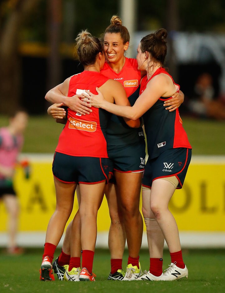 AFLW 2017 Rd 06 - Adelaide v Melbourne DARWIN, AUSTRALIA - MARCH 11: Alyssa Mifsud of the Demons (centre) celebrates a goal with teammates during the 2017 AFLW Round 06 match between the Adelaide Crows and the Melbourne Demons at TIO Stadium on March 11, 2017 in Darwin, Australia. (Photo by Michael Willson/AFL Media)