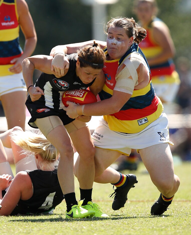 AFLW 2017 Rd 07 - Collingwood v Adelaide MELBOURNE, AUSTRALIA - MARCH 19: Bree White of the Magpies is tackled by Sarah Perkins of the Crows during the 2017 AFLW Round 07 match between the Collingwood Magpies and the Adelaide Crows at Olympic Park Oval on March 19, 2017 in Melbourne, Australia. (Photo by Michael Willson/AFL Media)