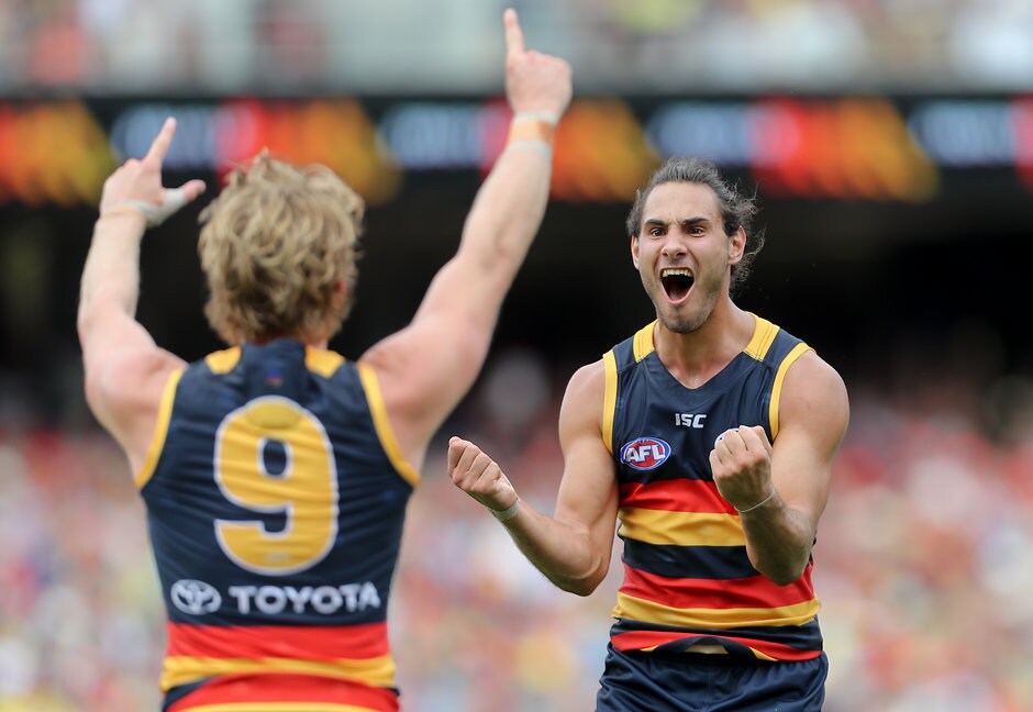AFL 2017 Round 01 - Adelaide v GWS Giants \ADELAIDE, AUSTRALIA - MARCH 26: Troy Menzel of the Crows celebrates a goal with team mate Rory Sloane during the 2017 AFL round 01 match between the Adelaide Crows and the GWS Giants at Adelaide Oval on March 26, 2017 in Adelaide, Australia. (Photo by AFL Media)