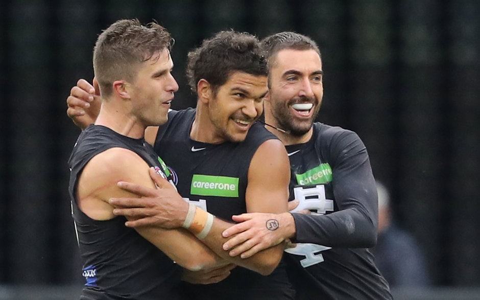 AFL 2017 Round 07 - Collingwood v Carlton MELBOURNE, AUSTRALIA - MAY 06: Sam Petrevski-Seton of the Blues is congratulated by Marc Murphy of the Blues and Kade Simpson of the Blues kicking a goal during the 2017 AFL round 07 match between the Collingwood Magpies and the Carlton Blues at the Melbourne Cricket Ground on May 06, 2017 in Melbourne, Australia. (Photo by Scott Barbour/AFL Media)
