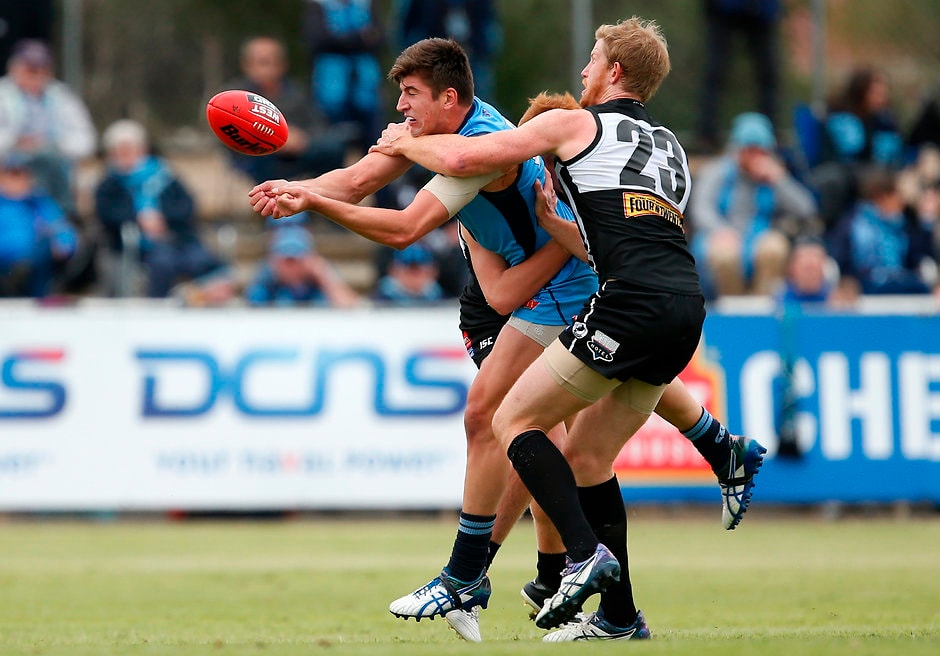 SANFL 2017 Round 05 - Port Adelaide v Sturt ADELAIDE, AUSTRALIA - MAY 07: Patrick Wilson of the Blues is tackled by Matthew Lobbe of the Magpies during the 2017 SANFL round 05 match between the Port Adelaide Magpies and Sturt at Alberton Oval on May 07, 2017 in Adelaide, Australia. (Photo by James Elsby/AFL Media)