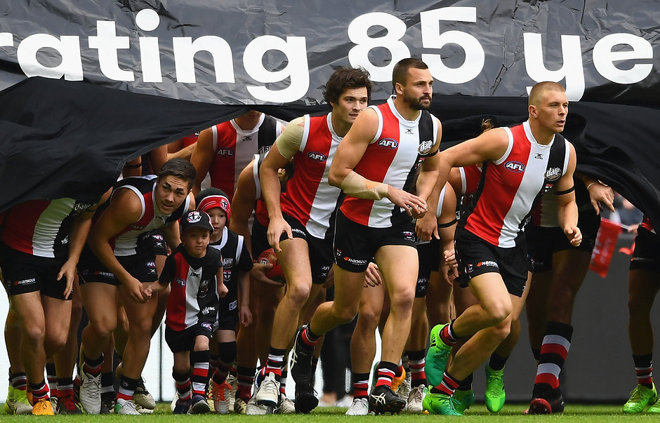 AFL 2017 Round 08 - St Kilda v Carlton MELBOURNE, AUSTRALIA - MAY 13: Jarryn Geary of the Saints leads his team through the banner during the round eight AFL match between the St Kilda Saints and the Carlton Blues at Etihad Stadium on May 13, 2017 in Melbourne, Australia. (Photo by Quinn Rooney/Getty Images/AFL Media)
