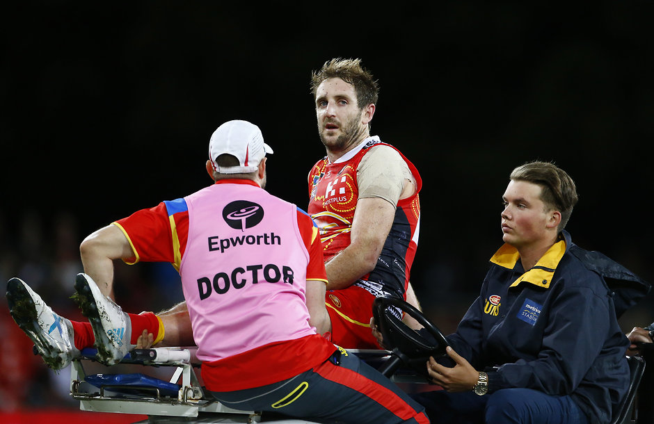 AFL 2017 Round 13 - Gold Coast v Carlton GOLD COAST, AUSTRALIA - JUNE 17: Michael Barlow of the suns suffers an injury during the 2017 AFL round 13 match between the Gold Coast Suns and the Carlton Blues at Metricon Stadium on June 17, 2017 in Gold Coast, Australia. (Photo by Jason O'Brien/AFL Media)