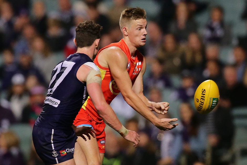 AFL 2017 Round 20 - Fremantle v Gold Coast PERTH, AUSTRALIA - AUGUST 05: Max Spencer of the Suns handpasses the ball during the 2017 AFL round 20 match between the Fremantle Dockers and the Gold Coast Suns at Domain Stadium on August 05, 2017 in Perth, Australia. (Photo by Will Russell/AFL Media)