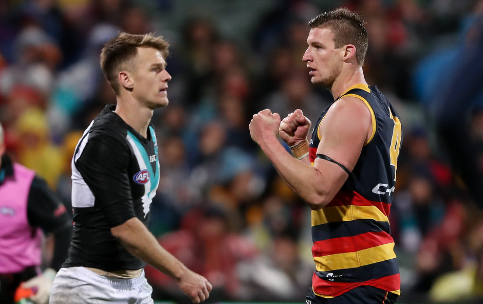 AFL 2017 Round 20 - Adelaide v Port Adelaide ADELAIDE, AUSTRALIA - AUGUST 06: Josh Jenkins of the Crows celebrates a goal as Robbie Gray of the Power looks on during the 2017 AFL round 20 match between the Adelaide Crows and the Port Adelaide Power at Adelaide Oval on August 06, 2017 in Adelaide, Australia. (Photo by AFL Media)
