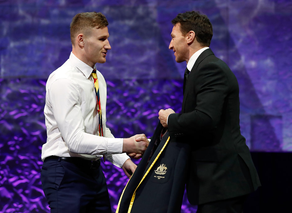 AFL 2017 Media - Virgin Australia AFL All Australian Awards MELBOURNE, AUSTRALIA - AUGUST 30: Rory Laird of the Crows is presented with his blazer by Brent Harvey during the 2017 Virgin Australia AFL All Australian Awards at the Palais Theatre on August 30, 2017 in Melbourne, Australia. (Photo by Adam Trafford/AFL Media)