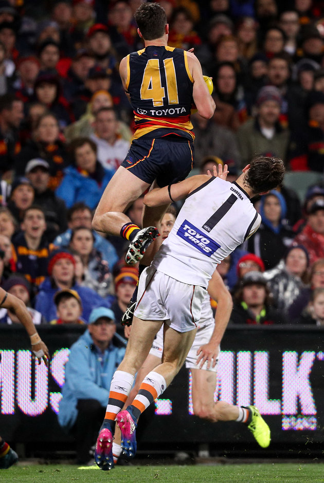 AFL 2017 First Qualifying Final - Adelaide v GWS Giants ADELAIDE, AUSTRALIA - SEPTEMBER 07: Mitch McGovern of the Crows marks the ball over Phil Davis of the Giants during the 2017 AFL First Qualifying Final match between the Adelaide Crows and the GWS Giants at the Adelaide Oval on September 07, 2017 in Adelaide, Australia. (Photo by AFL Media)