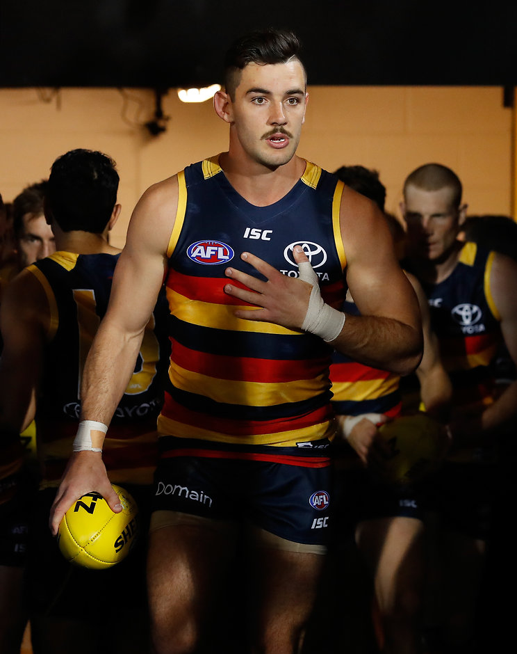 AFL 2017 First Preliminary Final - Adelaide v Geelong ADELAIDE, AUSTRALIA - SEPTEMBER 22: Taylor Walker of the Crows leads the team up the race during the 2017 AFL First Preliminary Final match between the Adelaide Crows and the Geelong Cats at Adelaide Oval on September 22, 2017 in Adelaide, Australia. (Photo by Adam Trafford/AFL Media)