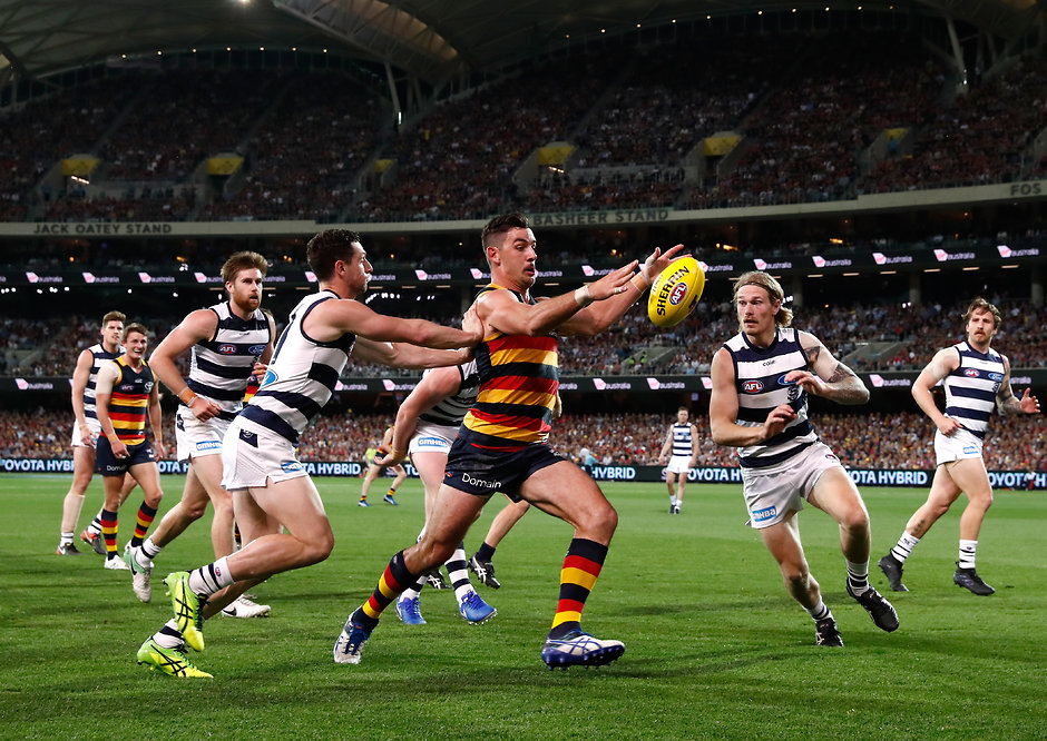 AFL 2017 First Preliminary Final - Adelaide v Geelong ADELAIDE, AUSTRALIA - SEPTEMBER 22: Taylor Walker of the Crows in action ahead of Darcy Lang (left) and Tom Stewart of the Cats during the 2017 AFL First Preliminary Final match between the Adelaide Crows and the Geelong Cats at Adelaide Oval on September 22, 2017 in Adelaide, Australia. (Photo by Adam Trafford/AFL Media)