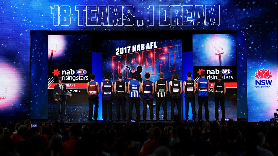 AFL 2017 Media - NAB AFL Draft SYDNEY, AUSTRALIA - NOVEMBER 24: The 2017 top 10 draftees (L-R) Cameron Rayner, Andrew Brayshaw, Paddy Dow, Luke Davies-Uniacke, Adam Cerra, Jaidyn Stephenson, Hunter Clark, Nicholas Coffield, Aaron Naughton and Lochie O'Brien pose for a photo onstage after the 2017 NAB AFL Draft at Sydney Showground on 24 November, 2017 in Sydney, Australia. (Photo by Brett Hemmings/AFL Media) (Editors note: This image is free for editorial use only)