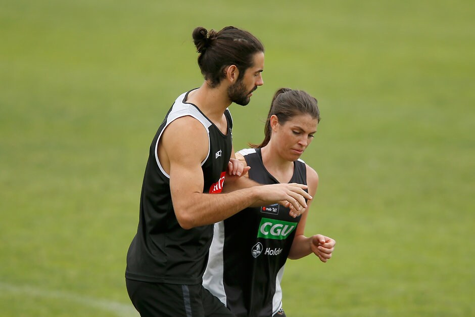 AFL 2017 Training - Collingwood 061217 Brodie Grundy and AFLW player Eliza Hynes at a joint pre-season session on Wednesday. Picture: Getty Images - AFL,Collingwood Magpies,Brodie Grundy,Mason Cox,Nathan Buckley