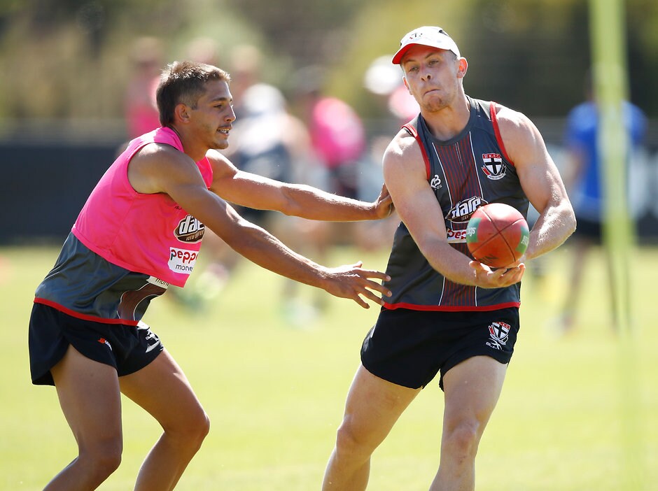 AFL 2017 Training - St Kilda 151217 MELBOURNE, AUSTRALIA - DECEMBER 15: Sebastian Ross of the Saints (right) handpasses the ball ahead of Ben Long of the Saints during the St Kilda Saints open training session at Linen House Centre on December 15, 2017 in Melbourne, Australia. (Photo by Adam Trafford/AFL Media)