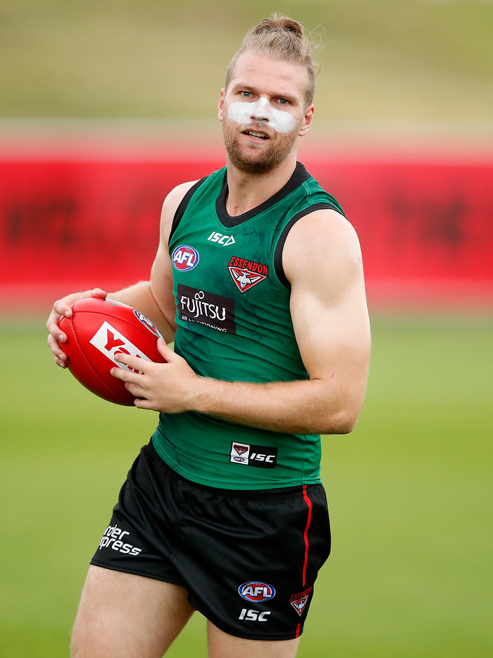AFL 2018 Training - Essendon 120118 Jake Stringer was forced from the field at Tullamarine on Friday - AFLX,Essendon Bombers,David Zaharakis,Hayden Skipworth,Dyson Heppell,Jake Stringer