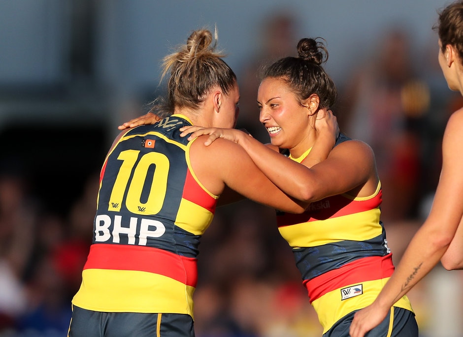 AFLW 2018 Rd 01 - Adelaide v Brisbane ADELAIDE, AUSTRALIA - FEBRUARY 3: Ruth Wallace of the Crows celebrates a goal with team mate Ebony Marinoff during the 2018 AFLW Round 01 match between the Adelaide Crows and the Brisbane Lions at Norwood Oval on February 3, 2018 in Adelaide, Australia. (Photo by AFL Media)