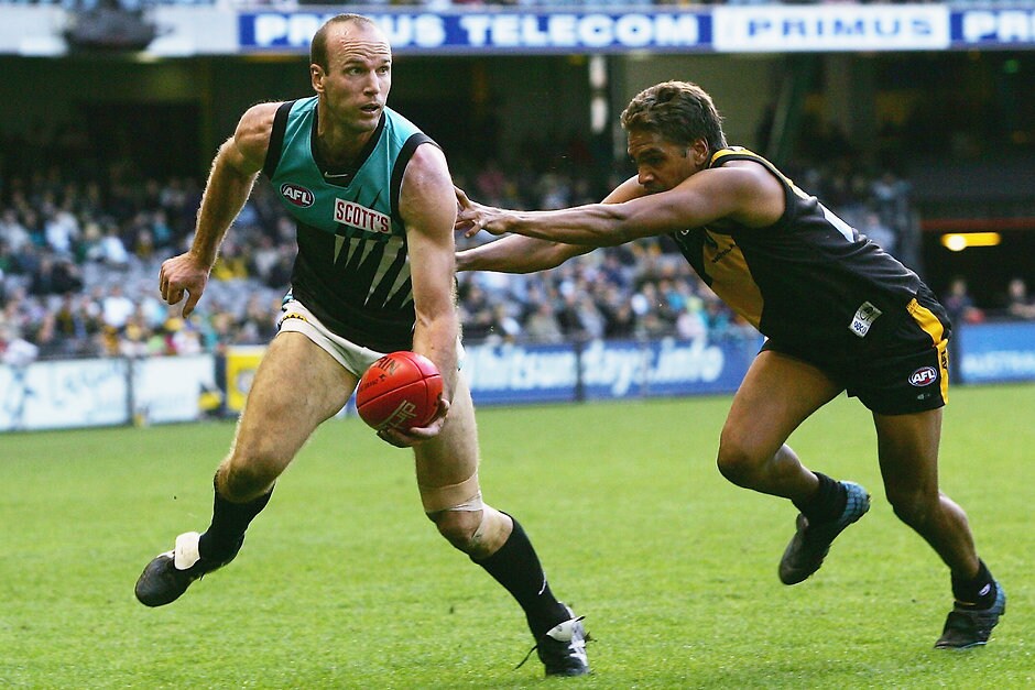 AFL 2005 Rd 6 - Richmond v Port Adelaide Josh Francou of the Power in action as Andrew Krakouer of the Tigers comes in to tackle during the round six AFL match between the Richmond Tigers and the Port Adelaide Power at the Telstra Dome May 1, 2005 in Melbourne, Australia.