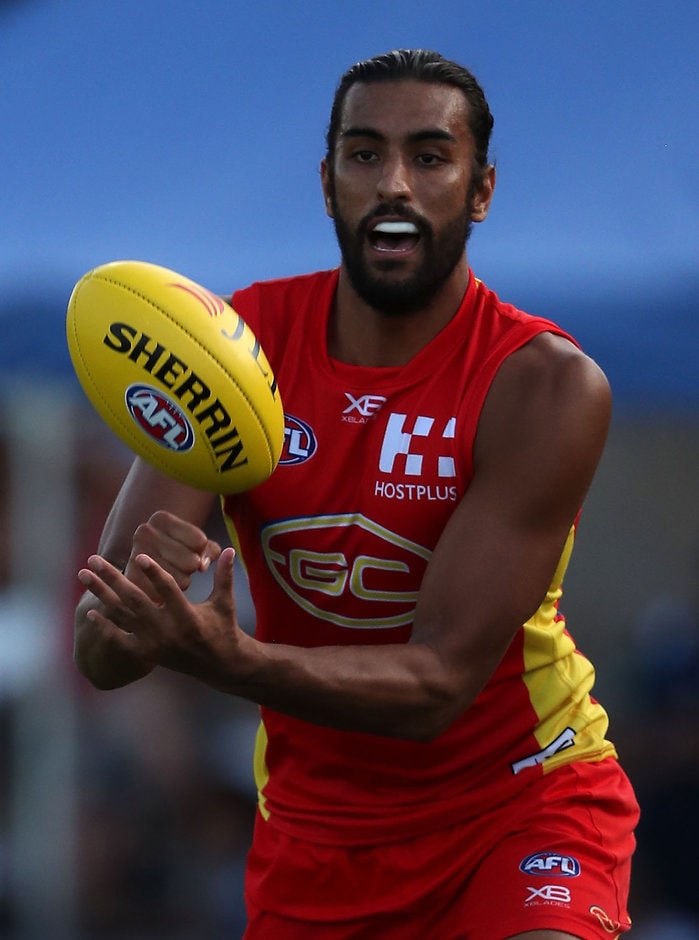 AFL 2018 JLT Community Series - Gold Coast v Geelong TOWNSVILLE, AUSTRALIA - MARCH 4: Tom Nicholls of the Suns in action during the AFL 2018 JLT Community Series match between the Gold Coast Suns and the Geelong Cats at Tony Ireland Stadium on March 4, 2018 in Townsville, Australia. (Photo by Sean Garnsworthy/AFL Media)