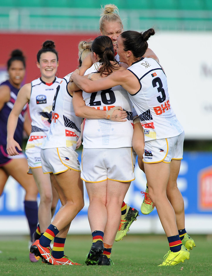 AFLW 2018 Rd 06 - Adelaide v Fremantle Crows players help Erin Phillips celebrate one of her three goals - AFLW,Adelaide Crows,Fremantle Dockers