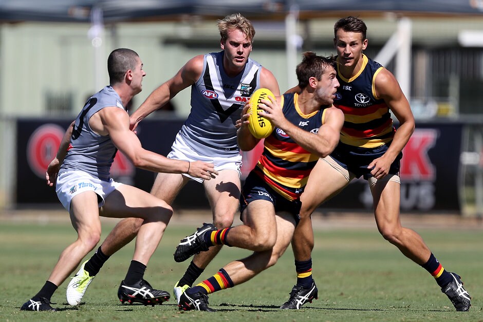 AFL 2018 JLT Community Series - Port Adelaide v Adelaide Crows ADELAIDE, AUSTRALIA - MARCH 10: Darcy Byrne-Jones of the Power tackles Richard Douglas of the Crows during the AFL 2018 JLT Community Series match between Port Adelaide and the Adelaide Crows at Alberton Oval on March 10, 2018 in Melbourne, Australia. (Photo by James Elsby/AFL Media)