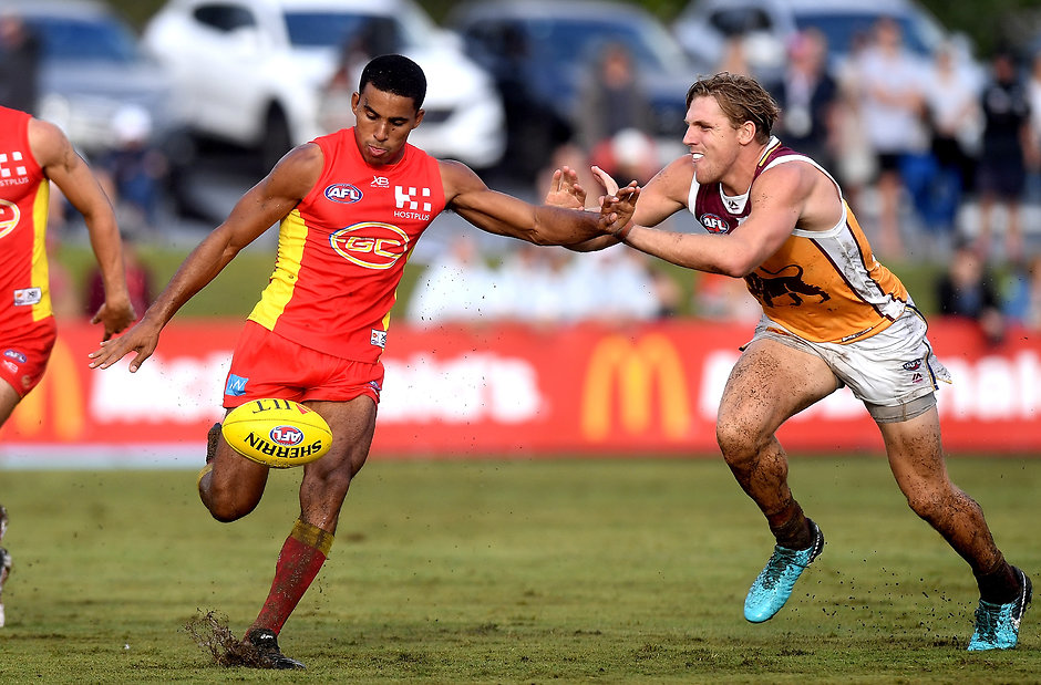 AFL 2018 JLT Community Series - Gold Coast v Brisbane Lions BRISBANE, AUSTRALIA - MARCH 11: Touk Miller of the Suns gets a kick away during the JLT Community Series AFL match between the Gold Coast Suns and the Brisbane Lions at Fankhauser Reserve on March 11, 2018 in Brisbane, Australia. (Photo by Bradley Kanaris/Getty Images)