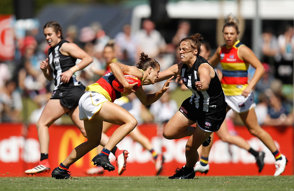 AFLW 2018 Rd 07 - Collingwood v Adelaide MELBOURNE, AUSTRALIA - MARCH 18: Chelsea Randall of the Crows and Jasmine Garner of the Magpies in action during the 2018 AFLW Round 07 match between the Collingwood Magpies and the Adelaide Crows at Olympic Park Oval on March 18, 2018 in Melbourne, Australia. (Photo by Michael Willson/AFL Media)