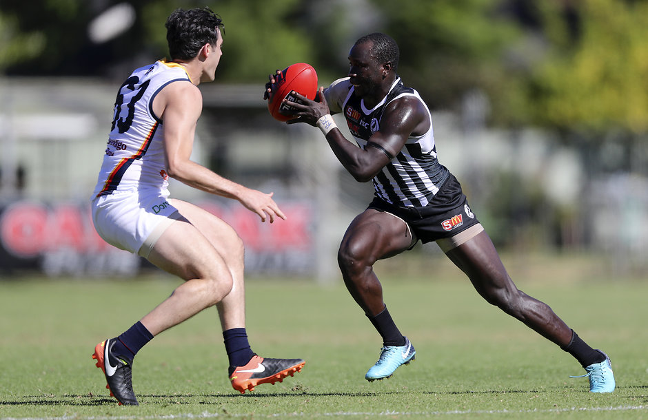 SANFL 2018 Round 01 - Port Adelaide v Adelaide ADELAIDE, AUSTRALIA - MARCH 31: Emmanuel Irra of the Magpies is tackled by Matthew Leigh of the Crows during the 2018 SANFL round 01 match between the Port Adelaide Magpies and Adelaide at Alberton Oval on March 31, 2018 in Adelaide, Australia. (Photo by AFL Media)