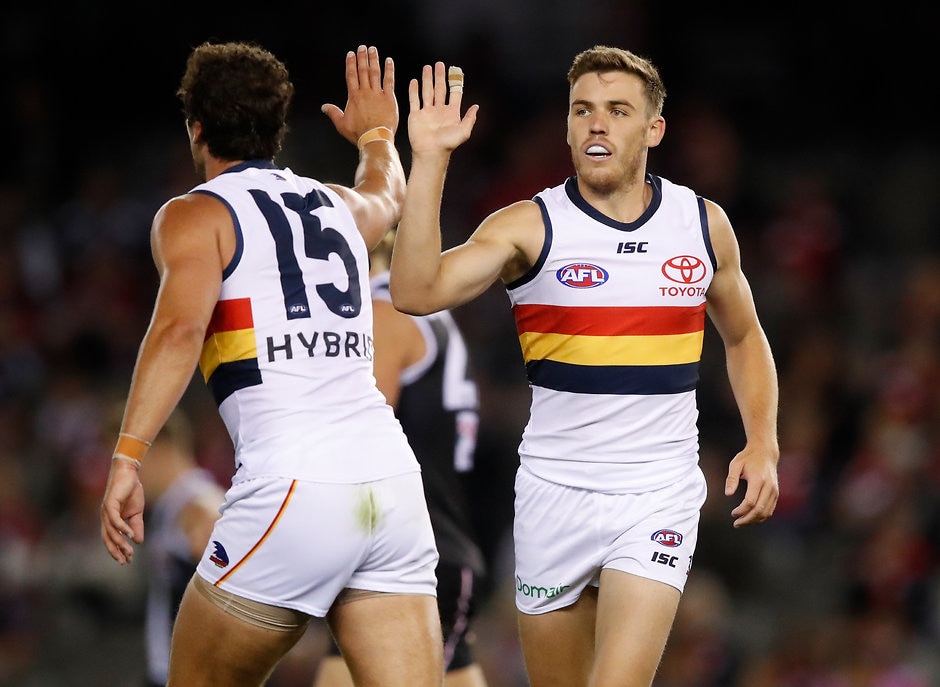 AFL 2018 Round 03 - St Kilda v Adelaide MELBOURNE, AUSTRALIA - APRIL 7: Paul Seedsman of the Crows (right) celebrates a goal with Kyle Hartigan of the Crows during the 2018 AFL round 03 match between the St Kilda Saints and the Adelaide Crows at Etihad Stadium on April 7, 2018 in Melbourne, Australia. (Photo by Adam Trafford/AFL Media)