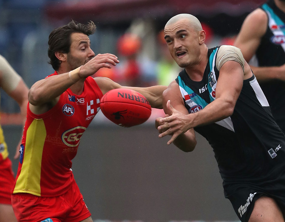 AFL 2018 Round 09 - Gold Coast v Port Adelaide SHANGHAI, CHINA - MAY 19: Sam Powell-Pepper of the Power handballs during the 2018 AFL round nine match between the Gold Coast Suns and the Port Adelaide Power at Adelaide Arena at Jiangwan Sports Stadium on May 19, 2018 in Shanghai, China. (Photo by Sean Garnsworthy/AFL Media)