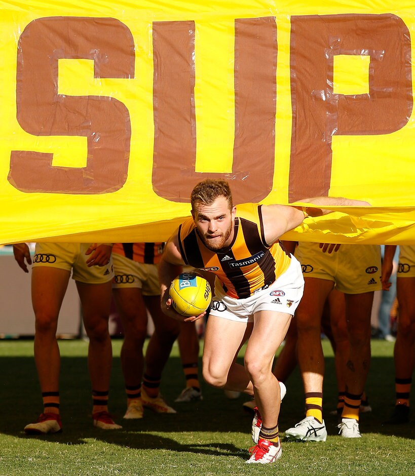 AFL 2018 Round 09 - Photographers Choice BRISBANE, AUSTRALIA - MAY 20: Tom Mitchell of the Hawks runs through the banner during the 2018 AFL round nine match between the Brisbane Lions and the Hawthorn Hawks at the Gabba on May 20, 2018 in Brisbane, Australia. (Photo by Michael Willson/AFL Media)