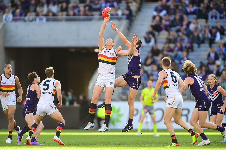 AFL 2018 Round 12 - Fremantle v Adelaide PERTH, AUSTRALIA - JUNE 10: Sam Jacobs of the Crows contests a ruck with Michael Apeness of the Dockers during the 2018 AFL round 12 match between the Fremantle Dockers and the Adelaide Crows at Optus Stadium on June 10, 2018 in Perth, Australia. (Photo by Daniel Carson/AFL Media)