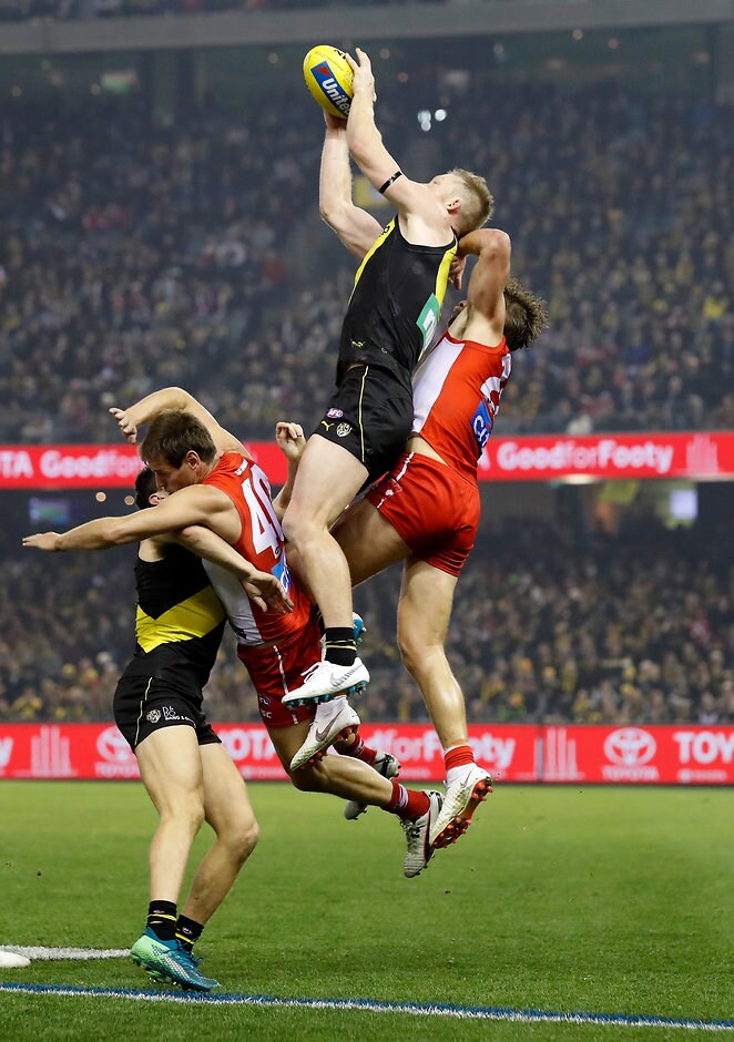 AFL 2018 Round 15 - Richmond v Sydney Richmond's Jack Riewoldt flies high for a mark over Sydney's Nick Smith - AFL,Richmond Tigers,Sydney Swans,Damien Hardwick,John Longmire