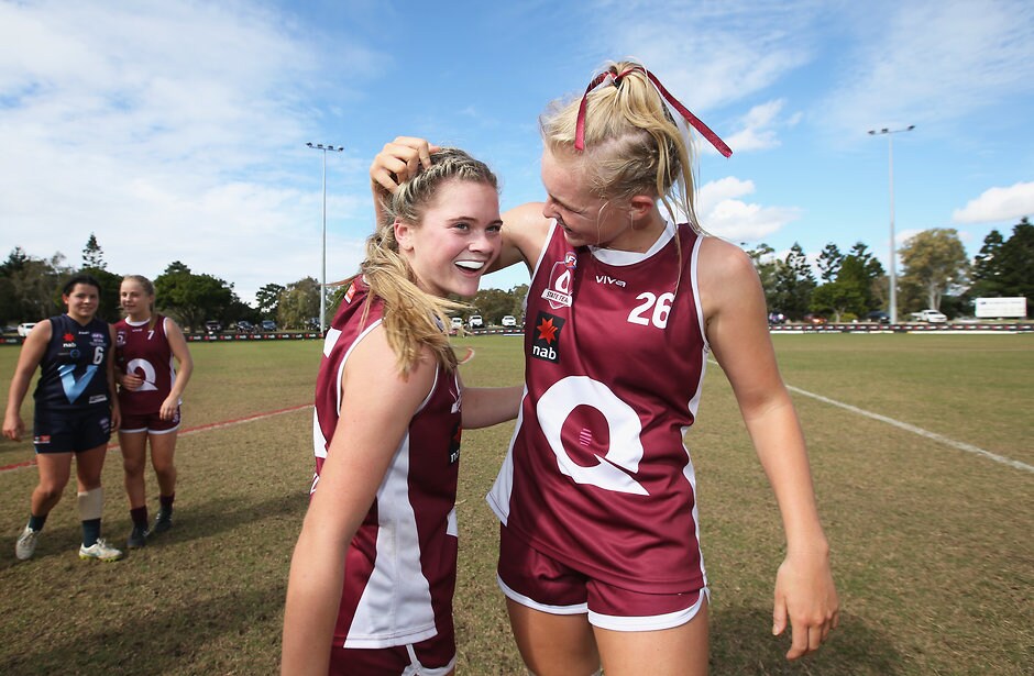 AFLW 2018 U18 Championships - Queensland v Vic Metro GOLD COAST, AUSTRALIA - JULY 11: Queensland's Lily Postlethwaite and Serene Watson celebrate during the AFLW U18 Championships match between Queensland and Vic Metro at Broadbeach Sports Club on July 11, 2018 in Gold Coast, Australia. (Photo by Jason O'Brien/AFL Media)