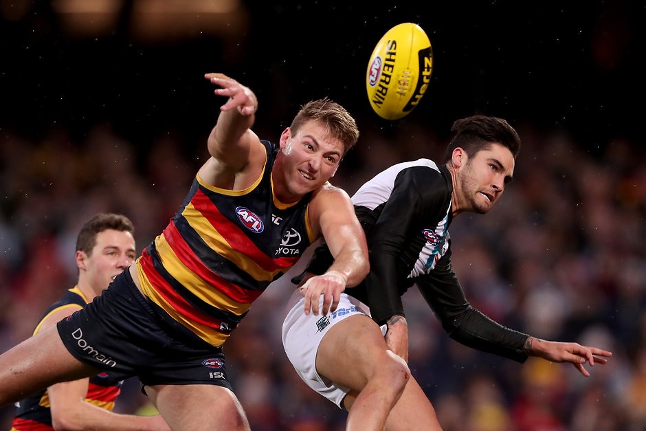 AFL 2018 Round 20 - Adelaide v Port Adelaide ADELAIDE, AUSTRALIA - AUGUST 04: Daniel Talia of the Crows clashes with Chad Wingard of the Power during the 2018 AFL round 20 match between the Adelaide Crows and the Port Adelaide Power at the Adelaide Oval on August 04, 2018 in Adelaide, Australia. (Photo by James Elsby/AFL Media)