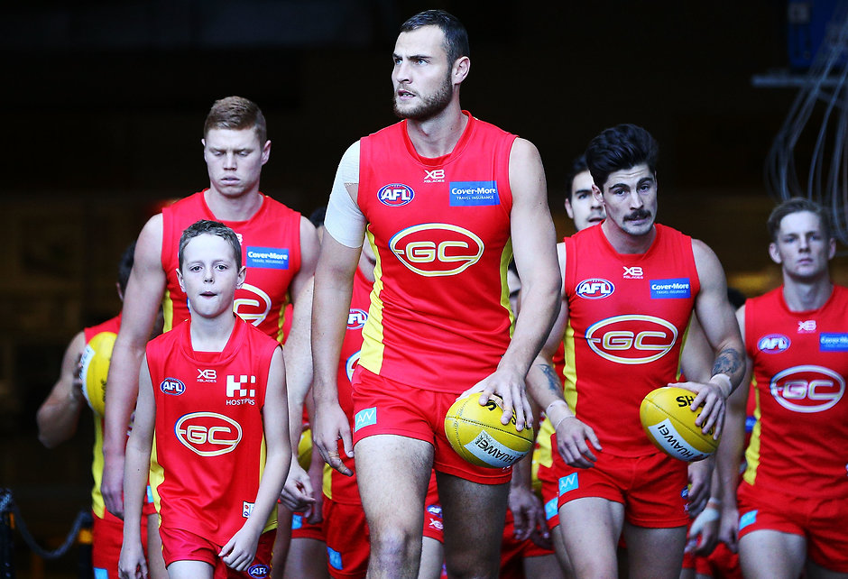 AFL 2018 Round 20 - Melbourne v Gold Coast MELBOURNE, AUSTRALIA - AUGUST 05: Jarrod Witts of the Suns leads the team out during the round 20 AFL match between the Melbourne Demons and the Gold Coast Suns at Melbourne Cricket Ground on August 5, 2018 in Melbourne, Australia. (Photo by Michael Dodge/Getty Images/AFL Media)