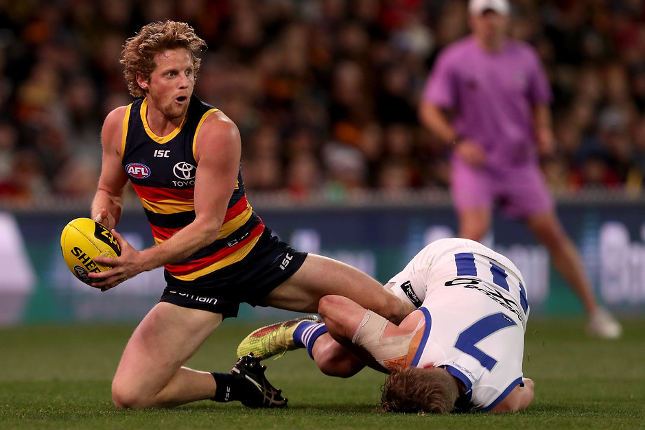 AFL 2018 Round 22 - Adelaide v North Melbourne ADELAIDE, AUSTRALIA - AUGUST 19: Rory Sloane of the Crows is tackled by Jack Ziebell of the Kangaroos during the 2018 AFL round 22 match between the Adelaide Crows and the North Melbourne Kangaroos at Adelaide Oval on August 19, 2018 in Adelaide, Australia. (Photo by James Elsby/AFL Media)