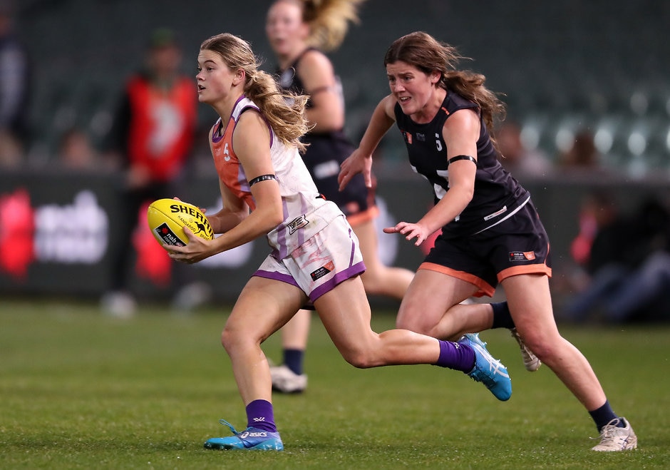 AFLW 2018 - U18 Exhibition Match ADELAIDE, AUSTRALIA - AUGUST 31: Lily Postlethwaite of the All Stars being chased by Daisy Bateman of Victoria during the U18 AFLW Exhibition Match between the All Stars and Victoria at Adelaide Oval on August 31, 2018 in Adelaide, Australia. (Photo by AFL Media)