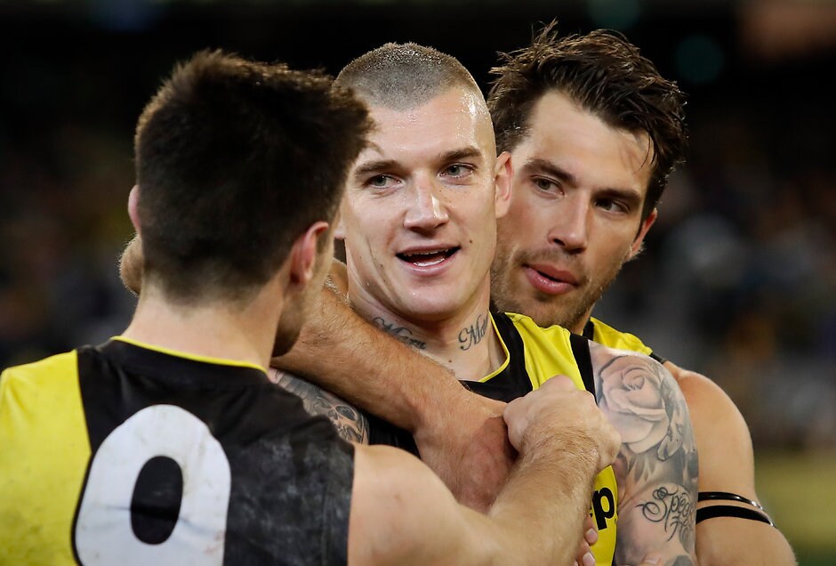 AFL 2018 First Qualifying Final - Richmond v Hawthorn MELBOURNE, AUSTRALIA - SEPTEMBER 06: Dustin Martin of the Tigers (middle) celebrates after his 200th game with Trent Cotchin (left) and Alex Rance of the Tigers during the 2018 AFL First Qualifying Final match between the Richmond Tigers and the Hawthorn Hawks at the Melbourne Cricket Ground on September 06, 2018 in Melbourne, Australia. (Photo by Adam Trafford/AFL Media)