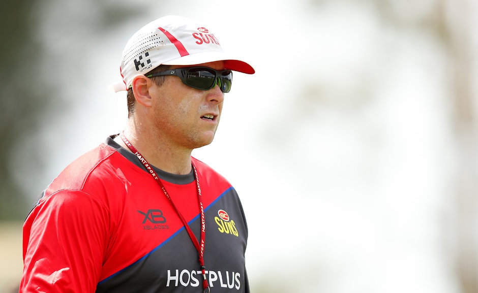 AFL 2018 Training - Gold Coast 131218 GOLD COAST, AUSTRALIA - DECEMBER 13: Stuart Dew, Senior Coach of the Suns chats to players during the Gold Coast Suns training session at Metricon Stadium on December 13, 2018 on the Gold Coast, Australia. (Photo by Adam Trafford/AFL Media)