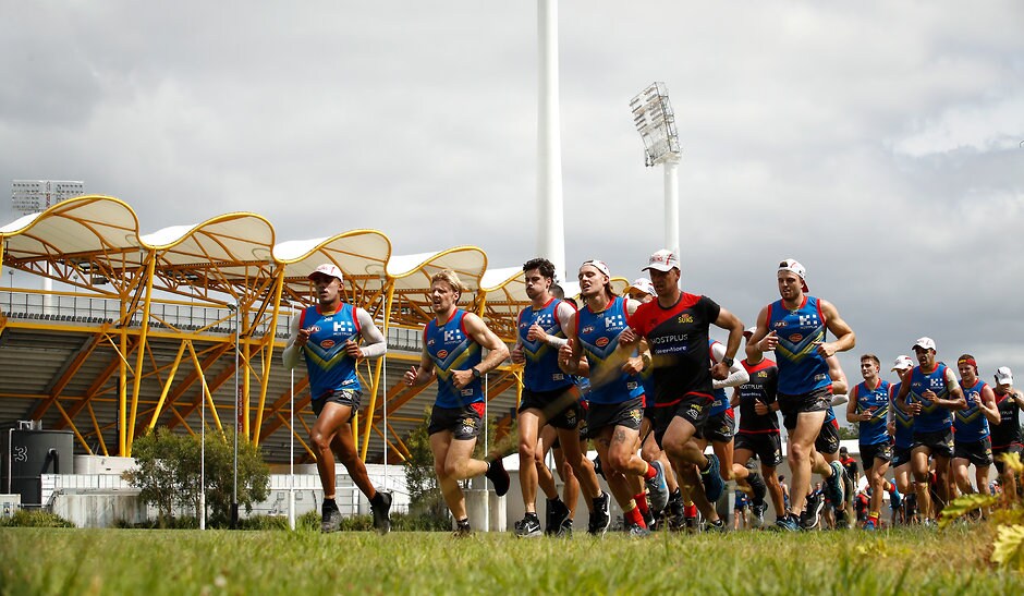 AFL 2018 Training - Gold Coast 131218 GOLD COAST, AUSTRALIA - DECEMBER 13: Suns players run laps during the Gold Coast Suns training session at Metricon Stadium on December 13, 2018 on the Gold Coast, Australia. (Photo by Adam Trafford/AFL Media)