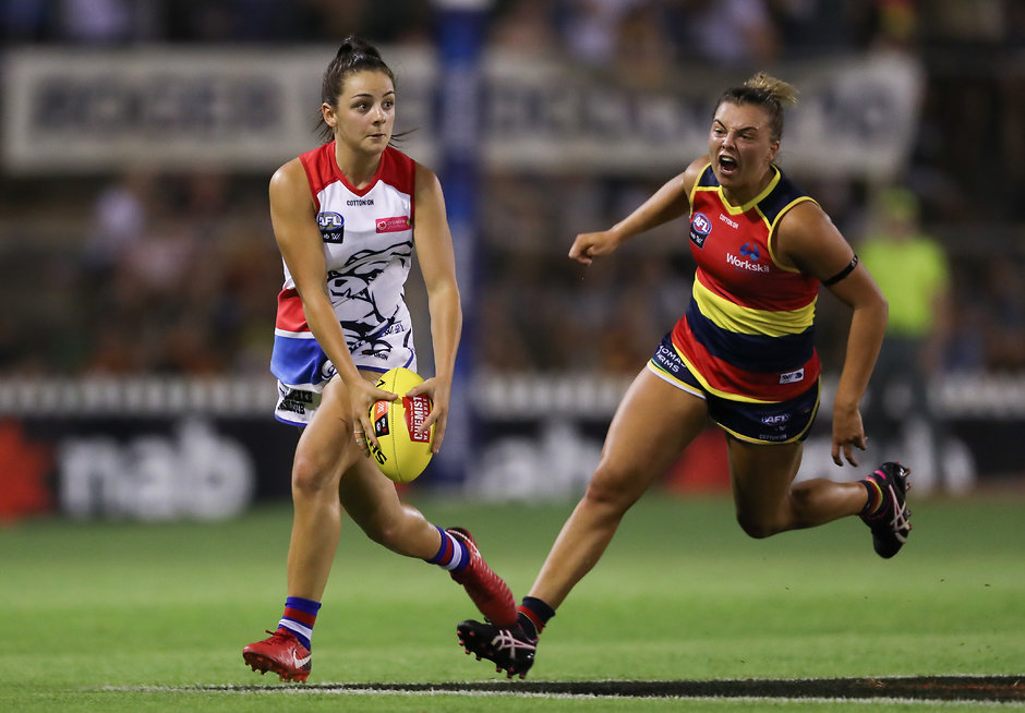 AFLW 2019 Rd 01 - Adelaide v Western Bulldogs ADELAIDE, AUSTRALIA - FEBRUARY 02: Monique Conti of the Bulldogs evades Ebony Marinoff of the Crows during the 2019 NAB AFLW Round 01 match between the Adelaide Crows and the Western Bulldogs at Norwood Oval on February 02, 2019 in Adelaide, Australia. (Photo by AFL Media)